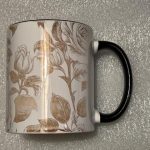 Floral print black handle 11 ounce coffee mug